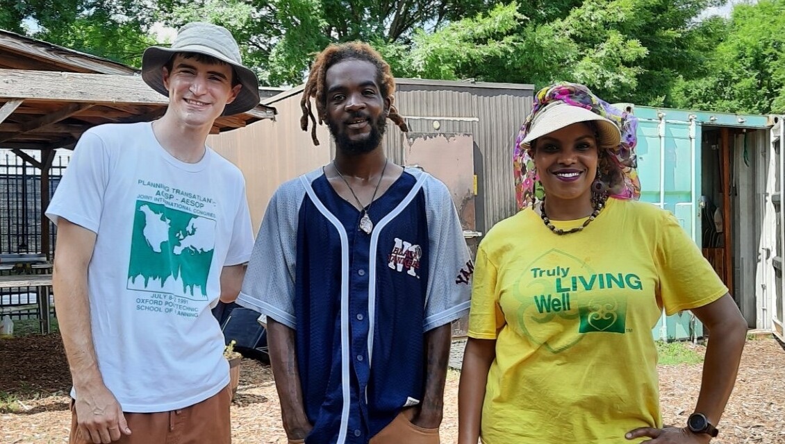 Three people looking at the camera